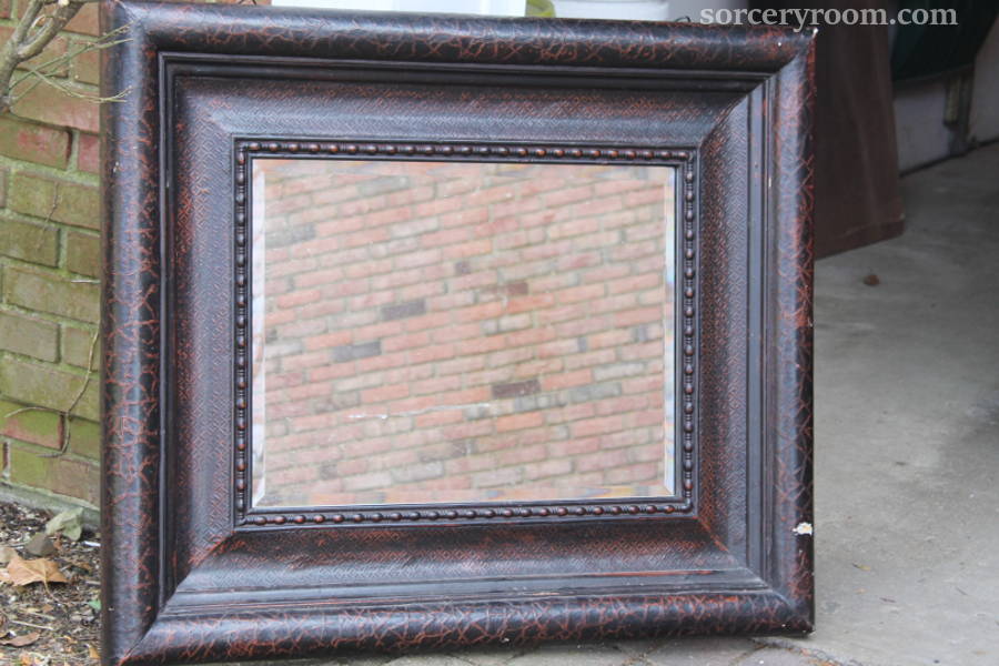 Mirror in a heavy dark brown frame