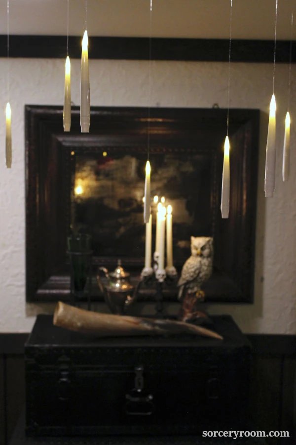 Harry Potter themed Halloween décor - floating candles in dark and moody interior setting