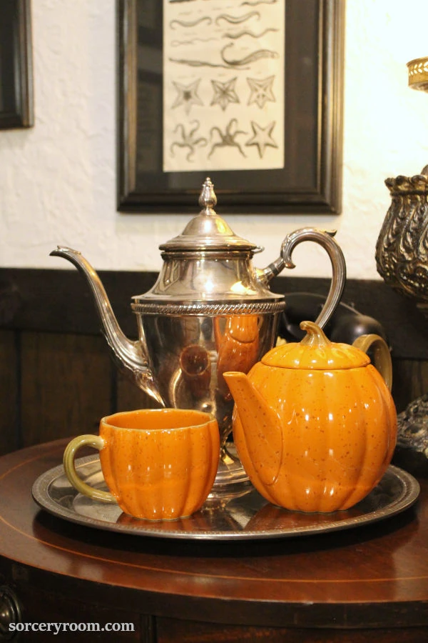 Harry Potter themed Halloween décor - a silver plated tea pot with a pumpkin shaped tea set